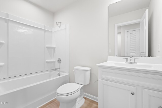 609 Silverado Sunset Loop, Wendell, NC 27591 - bathroom with vanity, shower / bath combination, wood finished floors, toilet, and baseboards