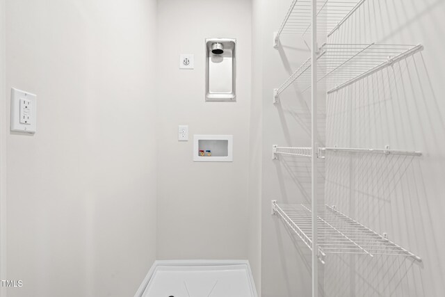 609 Silverado Sunset Loop, Wendell, NC 27591 - laundry room featuring washer hookup, electric dryer hookup, and baseboards