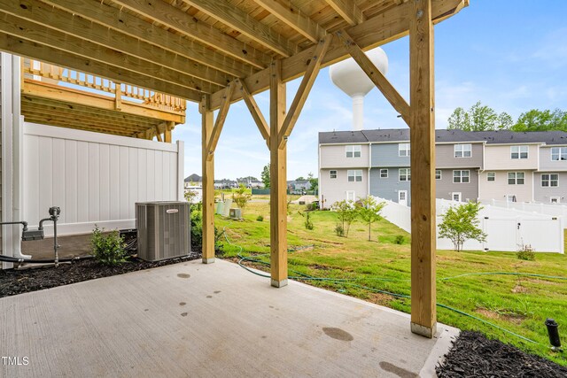 609 Silverado Sunset Loop, Wendell, NC 27591 - view of patio / terrace featuring central AC unit and a residential view