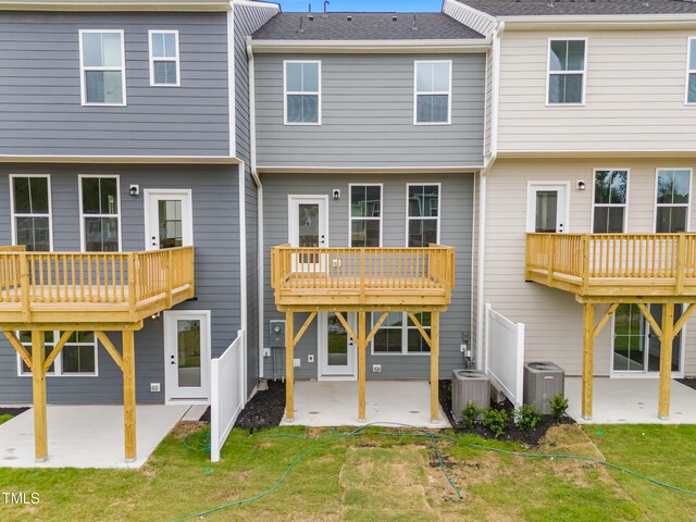609 Silverado Sunset Loop, Wendell, NC 27591 - back of property with a patio area, cooling unit, and a yard