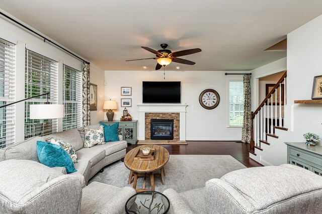 2739 Elderberry Ln, Apex, NC 27539 - living room featuring ceiling fan, wood finished floors, healthy amount of natural light, and stairway