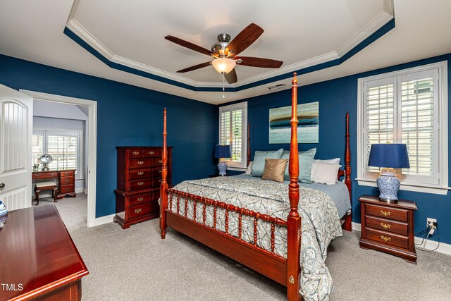2739 Elderberry Ln, Apex, NC 27539 - carpeted bedroom featuring a tray ceiling, ornamental molding, baseboards, and a ceiling fan