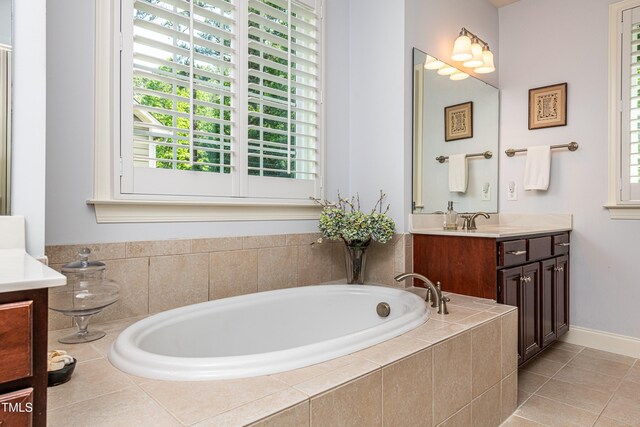 2739 Elderberry Ln, Apex, NC 27539 - bathroom with vanity, a bath, and tile patterned floors