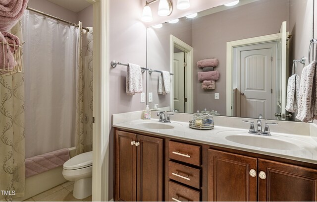 2739 Elderberry Ln, Apex, NC 27539 - full bathroom with tile patterned floors, toilet, double vanity, and shower / bath combo