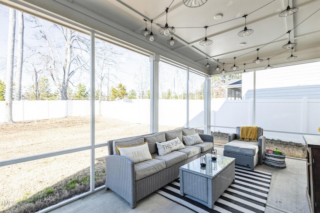 sunroom with an outdoor living space