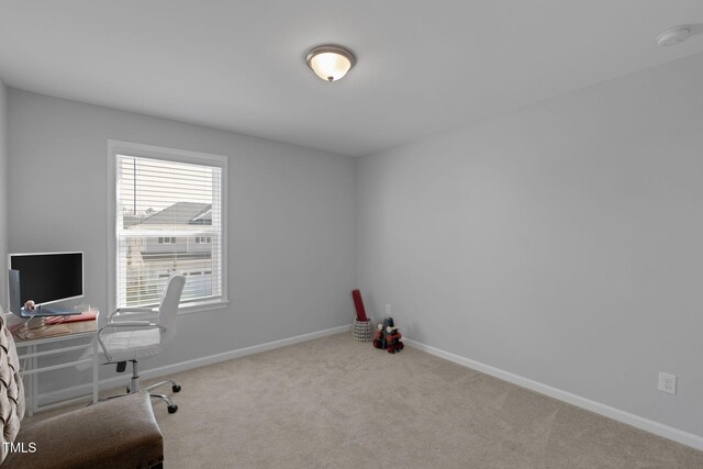 office with baseboards and carpet flooring