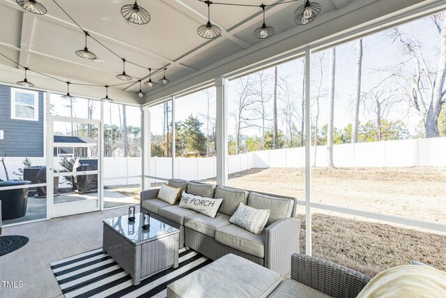 sunroom / solarium featuring outdoor lounge area