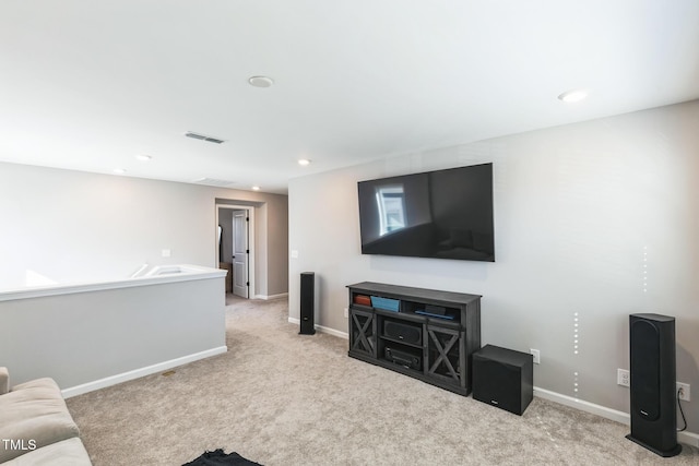 carpeted living area featuring recessed lighting, baseboards, and visible vents