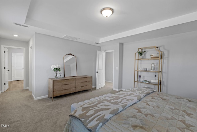 carpeted bedroom featuring baseboards and visible vents