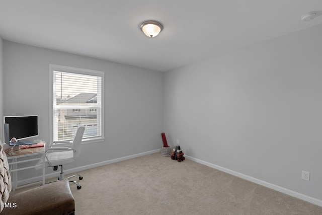office space featuring baseboards and carpet floors