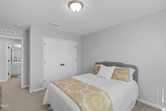 bedroom with baseboards, visible vents, and light colored carpet