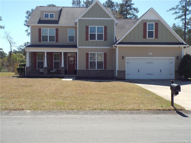 2105 Broadman Ave, Fayetteville, NC 28304 - craftsman-style house with a front lawn, a garage, board and batten siding, and concrete driveway