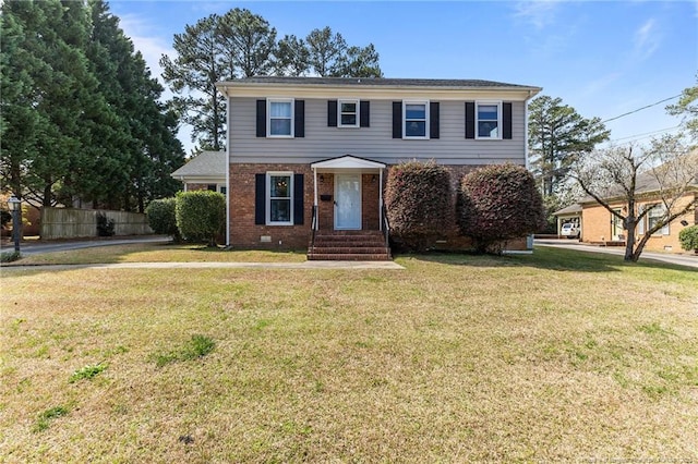2707 Bennington Rd, Fayetteville, NC 28303 - colonial-style house with brick siding, fence, and a front yard