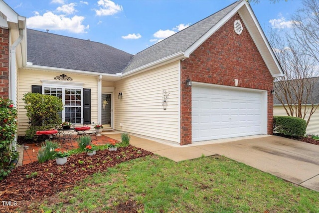 traditional-style home with brick siding, concrete driveway, a garage, and roof with shingles