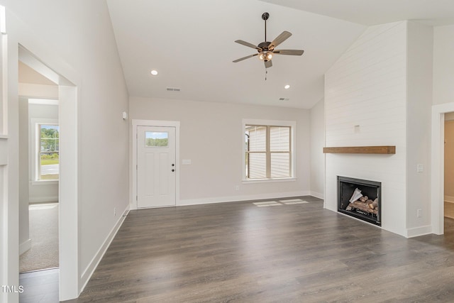 unfurnished living room featuring visible vents, baseboards, ceiling fan, dark wood finished floors, and a fireplace