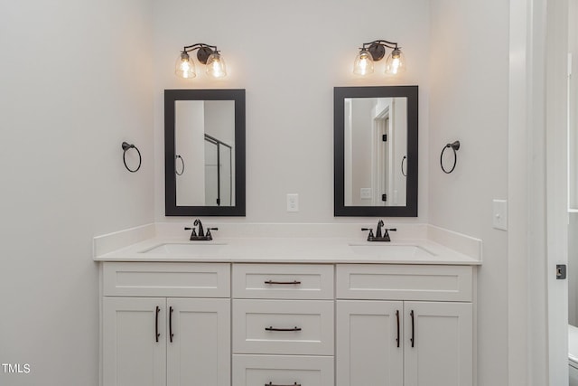 bathroom featuring double vanity and a sink