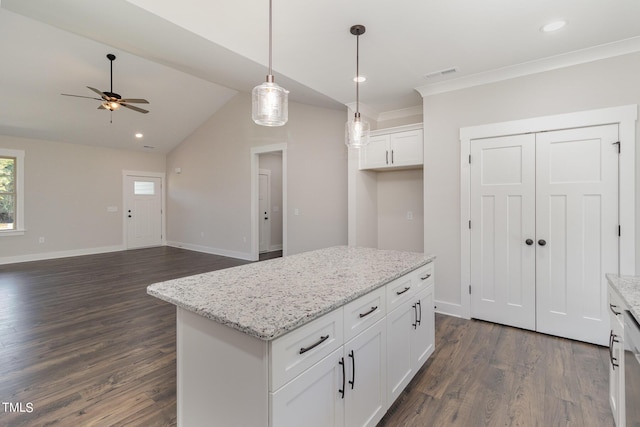 kitchen featuring visible vents, dark wood-style flooring, white cabinetry, and ceiling fan