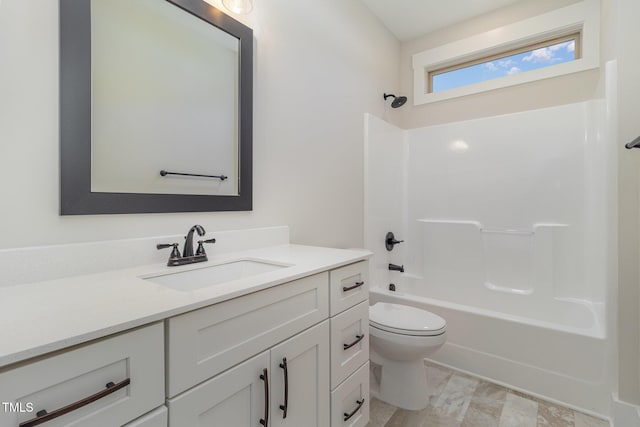 full bath featuring toilet, vanity, and tub / shower combination