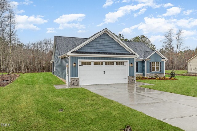 613 Tuscany Cir, Princeton, NC 27569 - craftsman-style home with an attached garage, concrete driveway, a front lawn, and stone siding