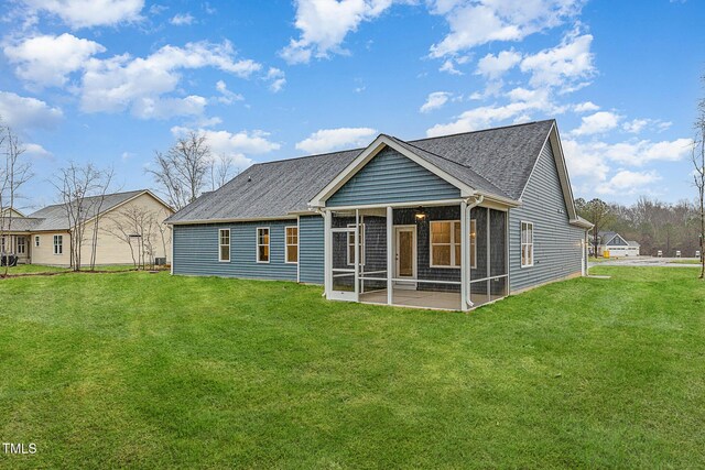 613 Tuscany Cir, Princeton, NC 27569 - rear view of property with a sunroom, a lawn, and a shingled roof