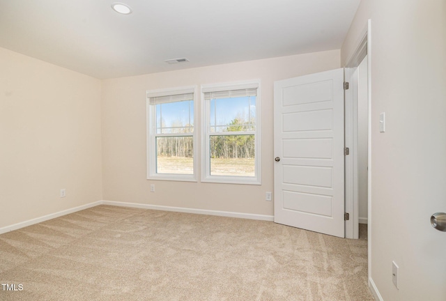 300 Tuscany Cir, Princeton, NC 27569 - spare room featuring light colored carpet, baseboards, and visible vents