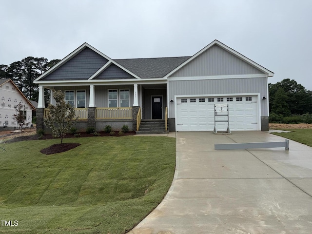 221 Tee Dr, Selma, NC 27576 - craftsman inspired home with a garage, concrete driveway, a porch, and a front yard