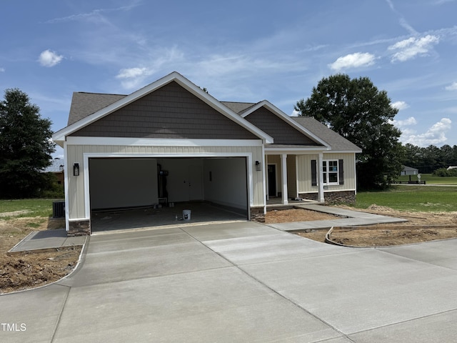 28 Bailey-Boykin Rd, Selma, NC 27576 - view of front of property with a garage, concrete driveway, and board and batten siding