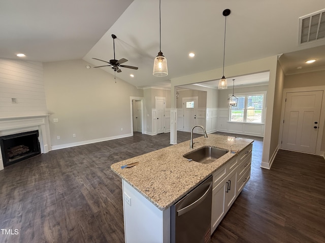 28 Bailey-Boykin Rd, Selma, NC 27576 - kitchen with stainless steel dishwasher, open floor plan, a ceiling fan, dark wood finished floors, and a fireplace
