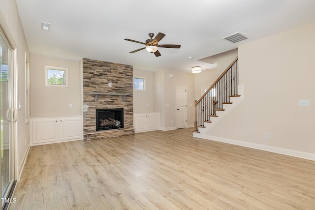 18 Bonnybrook Ct, Selma, NC 27576 - unfurnished living room with light wood-style flooring, plenty of natural light, a ceiling fan, and stairs