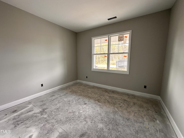 empty room featuring baseboards