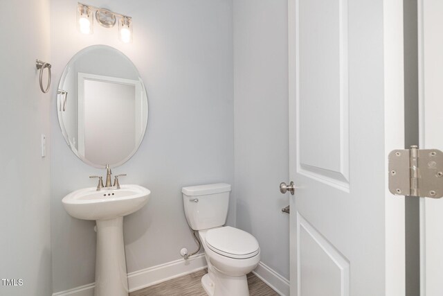 98 Laramie Ln, Selma, NC 27576 - bathroom featuring baseboards and wood finished floors