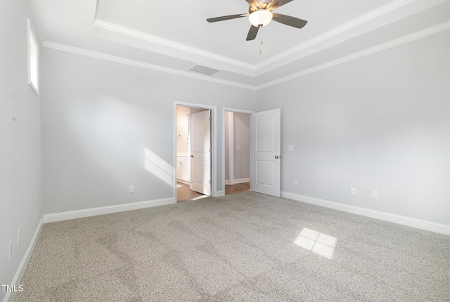 98 Laramie Ln, Selma, NC 27576 - unfurnished bedroom with a raised ceiling, carpet floors, crown molding, connected bathroom, and a ceiling fan