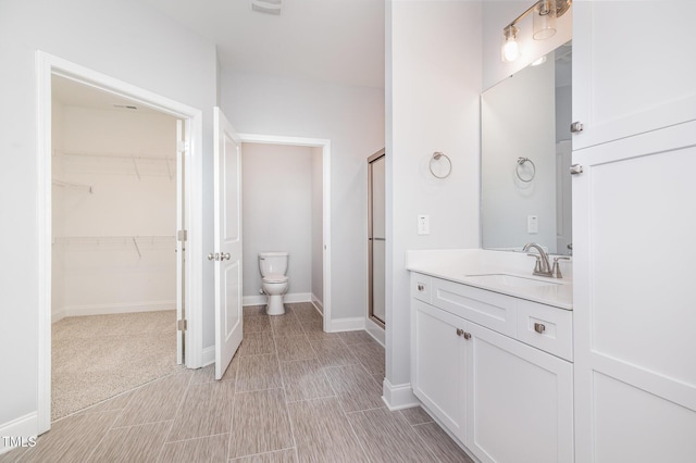 98 Laramie Ln, Selma, NC 27576 - bathroom with vanity, a shower stall, and a spacious closet
