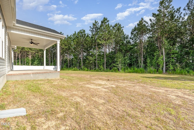 98 Laramie Ln, Selma, NC 27576 - view of green lawn with a ceiling fan and a patio