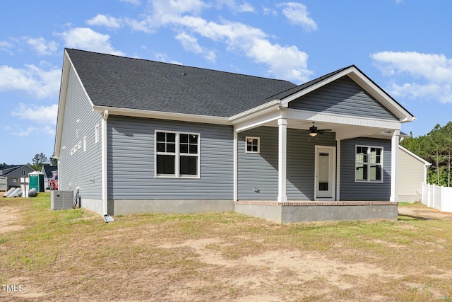 98 Laramie Ln, Selma, NC 27576 - back of house featuring a ceiling fan, a yard, and a shingled roof