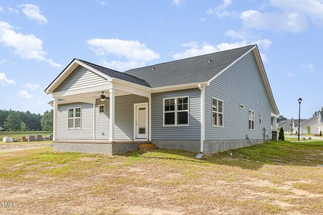 98 Laramie Ln, Selma, NC 27576 - view of front of property with a ceiling fan, a front yard, and a shingled roof