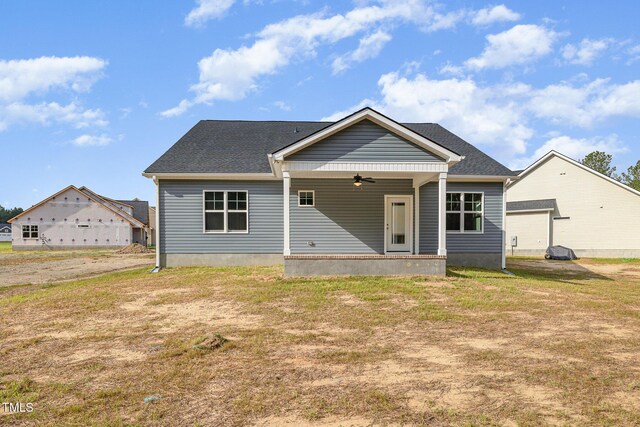 98 Laramie Ln, Selma, NC 27576 - rear view of property with a ceiling fan and a yard