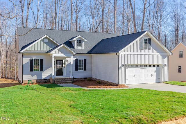 3027 Wesley Farm Ln, Sophia, NC 27350 - view of front facade featuring driveway, a front yard, board and batten siding, a shingled roof, and crawl space