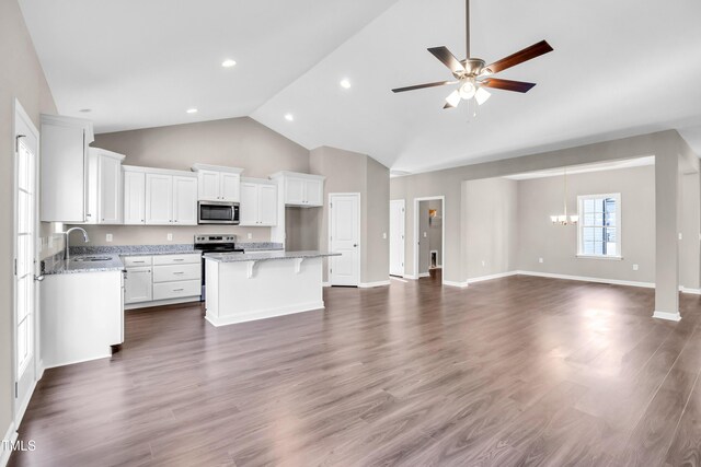 3027 Wesley Farm Ln, Sophia, NC 27350 - kitchen featuring white cabinets, appliances with stainless steel finishes, a sink, open floor plan, and a center island