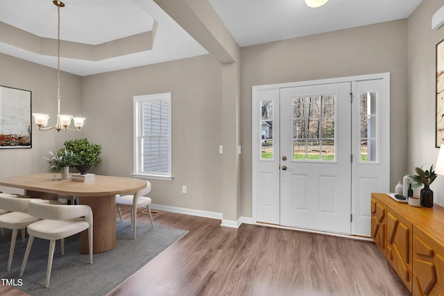 3027 Wesley Farm Ln, Sophia, NC 27350 - entrance foyer with a tray ceiling, baseboards, a notable chandelier, and wood finished floors