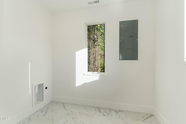 clothes washing area featuring electric panel, hookup for an electric dryer, laundry area, marble finish floor, and baseboards