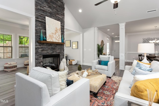 1053 Beechcraft Dr Unit 124, Mebane, NC 27302 - living room featuring crown molding, decorative columns, a ceiling fan, a fireplace, and wood finished floors