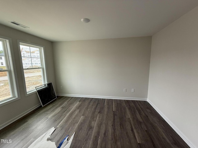 43 Chloe Ct, Selma, NC 27577 - empty room featuring dark wood-type flooring and baseboards