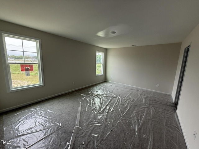 43 Chloe Ct, Selma, NC 27577 - spare room featuring carpet flooring and baseboards