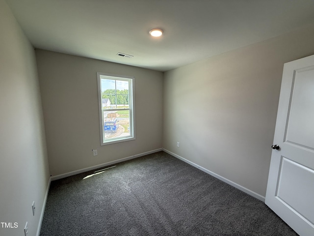 43 Chloe Ct, Selma, NC 27576 - empty room featuring dark carpet and baseboards