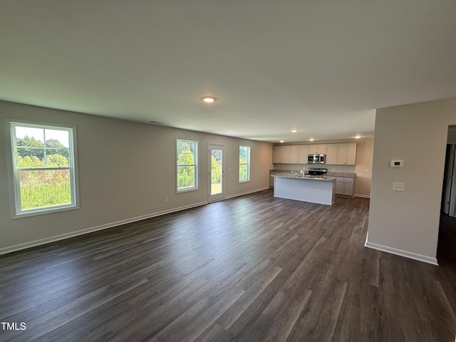 43 Chloe Ct, Selma, NC 27576 - unfurnished living room with recessed lighting and dark wood-style floors