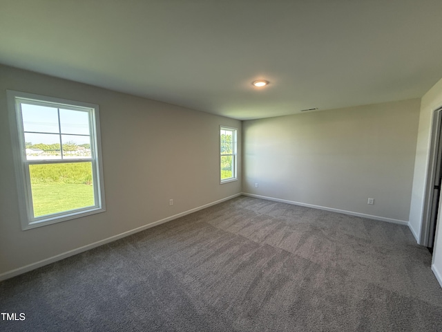 43 Chloe Ct, Selma, NC 27576 - carpeted empty room with baseboards and recessed lighting