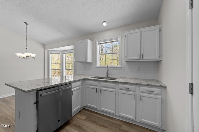 5408 Rivercrest Dr, Youngsville, NC 27596 - kitchen featuring a sink, dishwasher, a peninsula, white cabinets, and dark wood-type flooring
