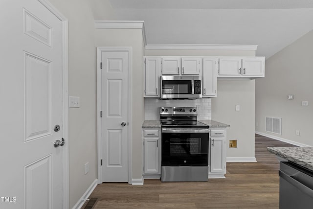 5408 Rivercrest Dr, Youngsville, NC 27596 - kitchen featuring decorative backsplash, dark wood-style flooring, appliances with stainless steel finishes, and visible vents