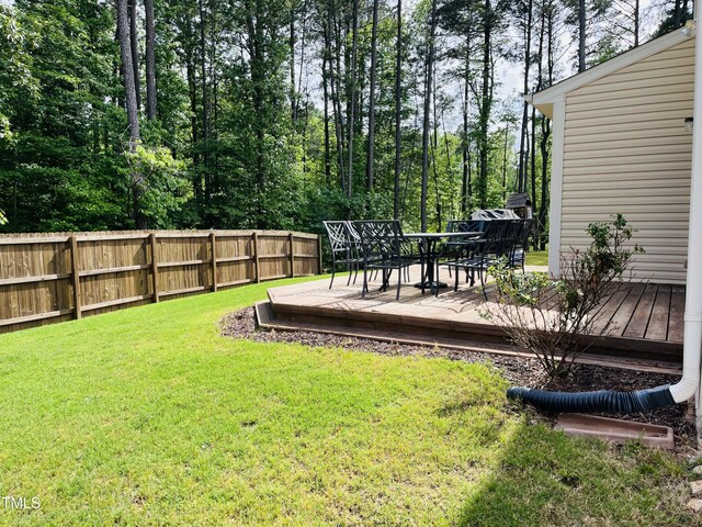 303 Fortress Dr, Morrisville, NC 27560 - view of yard with fence, outdoor dining space, and a deck
